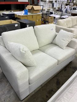 Cream fabric loveseat sofa
