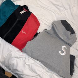 Pair Of Supreme Sweaters