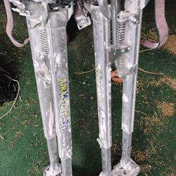 These are Dura-Stilts Dura-III drywall stilts, commonly used in construction and painting to reach high areas without a ladder. 