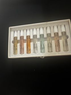 Diverse collection of eight 2ml perfume sample vials. This set includes scents such as Monet Garden, Cool Town, Wild Rose, and Plaid Skirt. Each glass