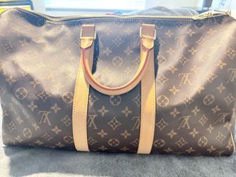 Luis Vuitton purse/duffle bag