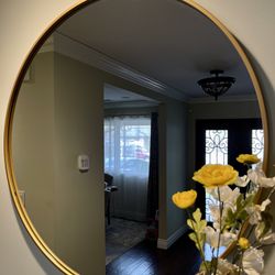 Emma and Oliver Gold 30" Round Metal Wall Mounted Mirror with Oxidized Finish