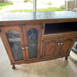 Decorative cabinet with regular shelves and a pull-out shelf