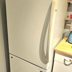 Amana bottom freezer refrigerator.  Must be gone by 2/22/26.