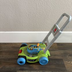V Tech Kids Top Pop and spin Lawn Mower Interactive Lights and Sounds 