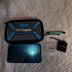 Aqua Blue Nintendo 3DS With Case, Charger, Three Stylusses, And A Couple Game Cases
