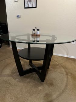 Brown base with glass top dining table