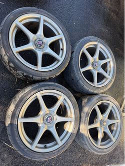 OEM Nissan R34 Skyline GT-R wheels.