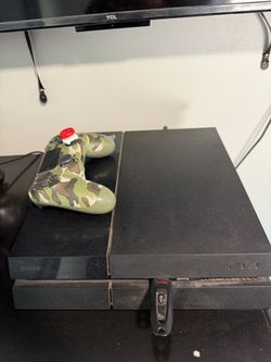PS4 with 2 controls and games