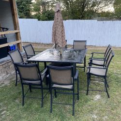 1 Table 8 Chairs 1 Umbrella 