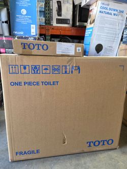 Toto C857D one-piece toilet with a TC395VS seat and cover