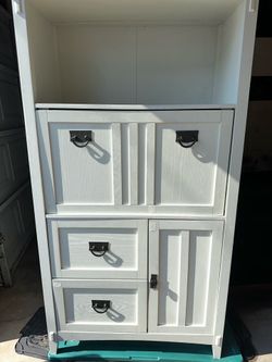 For Sale: Artisan-Style White Cabinet  This beautiful artisan-style white cabinet features distinctive dark hammered hardware and a textured wood grai