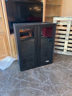 Black Storage with Glass Doors and Two Glass Shelves