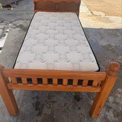 Twin xl bed with a twin mattress ontop