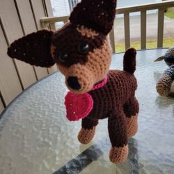 Hand crocheted brown and tan dog with heart collar.