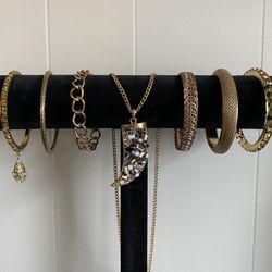 Gold And Gem Tooth Necklace With 6 Bracelets.