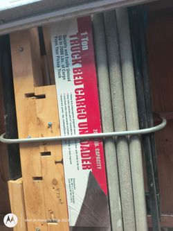 Truck bed cargo unloader