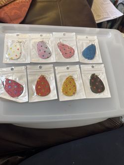 Set of sparkly teardrop earrings with tiny heart confetti. Glitter finish in multiple colorways. Lightweight with fishhook ear wires. Great for playfu