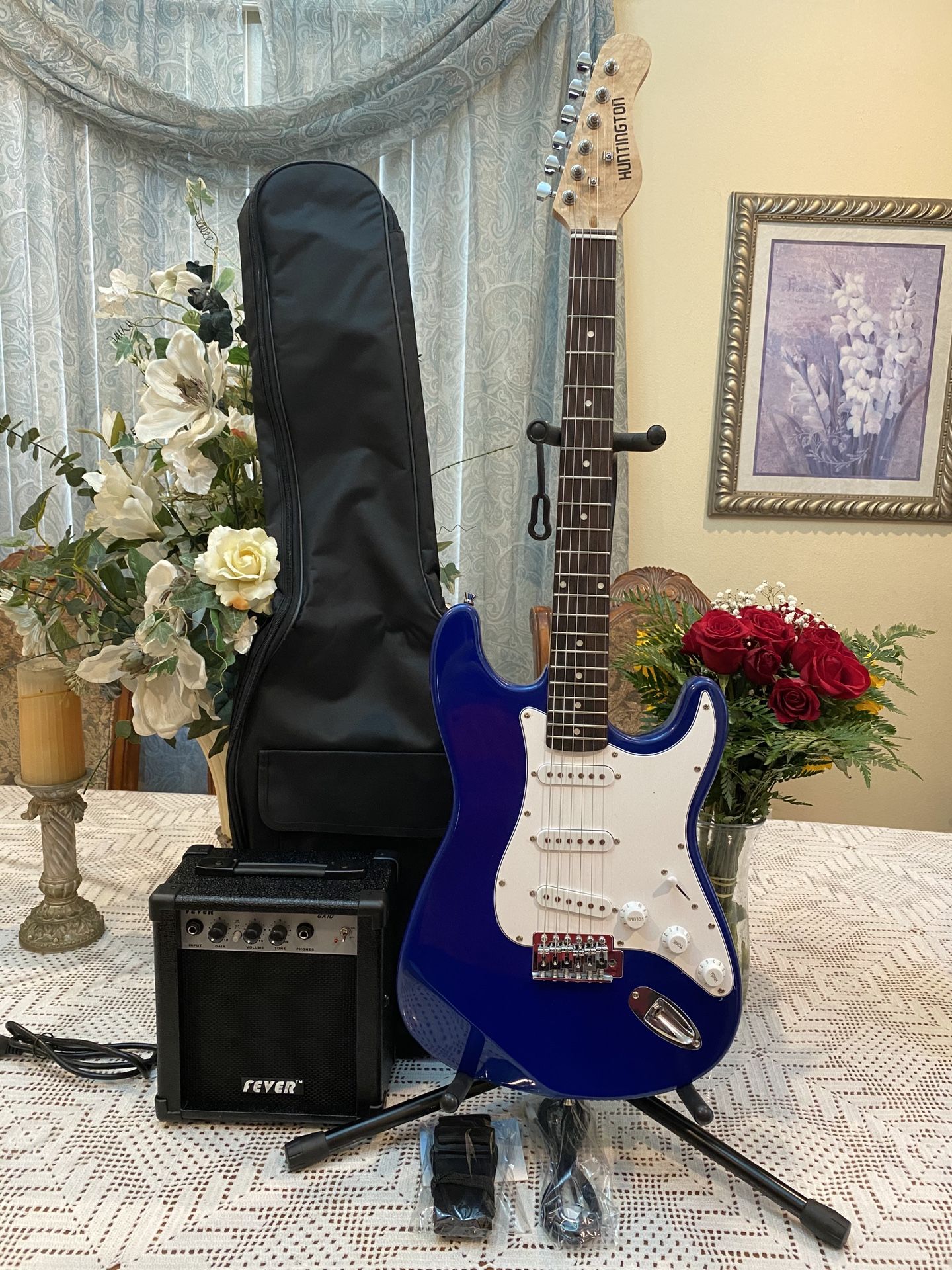 blue huntington electric guitar with amp case strap and cable