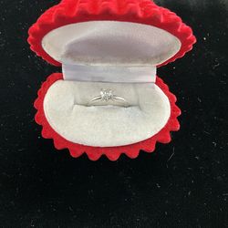 Platinum solitaire ring with a heart shaped stone (price available upon request