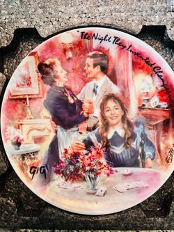 This image shows a Henri D'Arceau-Limoges Gigi collectible plate featuring the artwork "The Night They Invented Champagne" by Jean-Claude Guidou