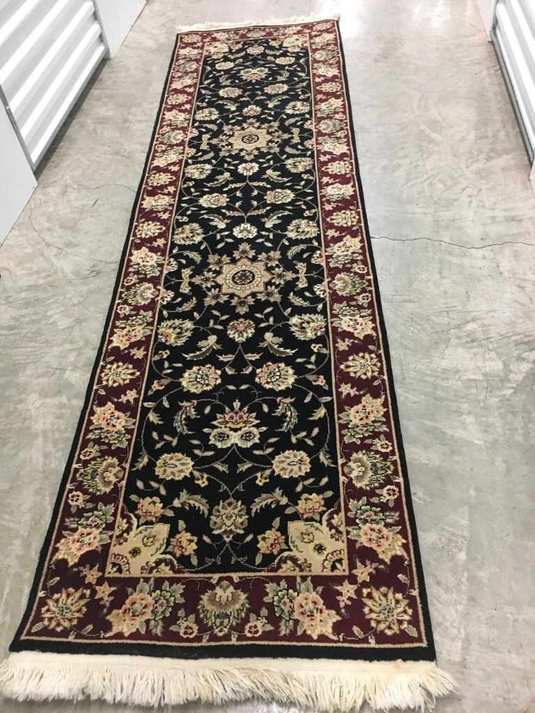 Black and brown floral area rug