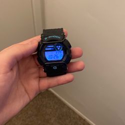 Black and blue G shock watch 