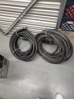 two 50 foot Goodyear black rubber hoses