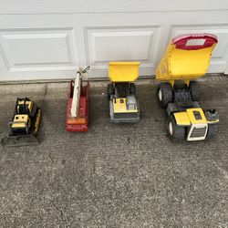 4 old-school metal toys in decent shape. The firetruck is pretty rare.  all of them could use a little cleaning if you want to use them for a display.