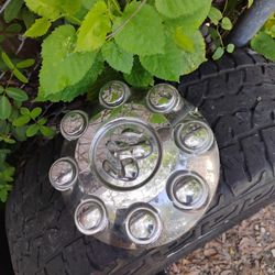 Four Dodge Rims and Hubs With Tires