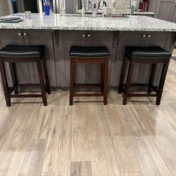 3 saddle style, counter height stools
