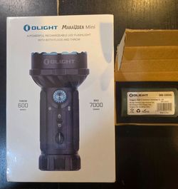 Olight Marauder mini 7000 Lumens Rechargeable Flashlight.  BLACK AND ORANGE  AVAILABLE
