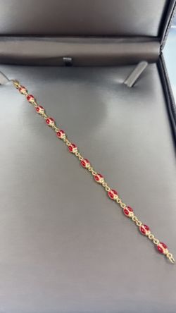 Brazalete de catarinas en oro 14 k