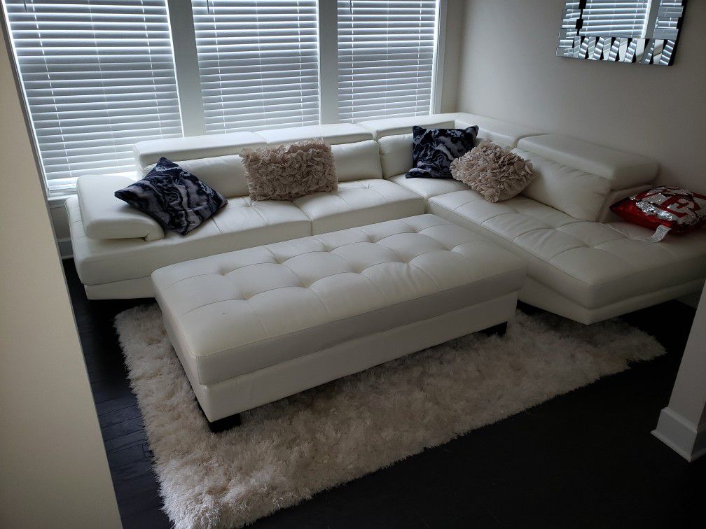 White leather couch, Chase, and ottoman