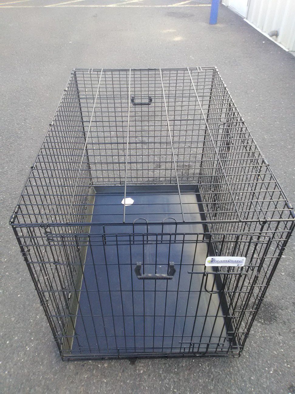Dog Cage/ Crate extra large new folds for easy Storage or transport includes double doors and bottom changing tray pick up a curbside del. avail