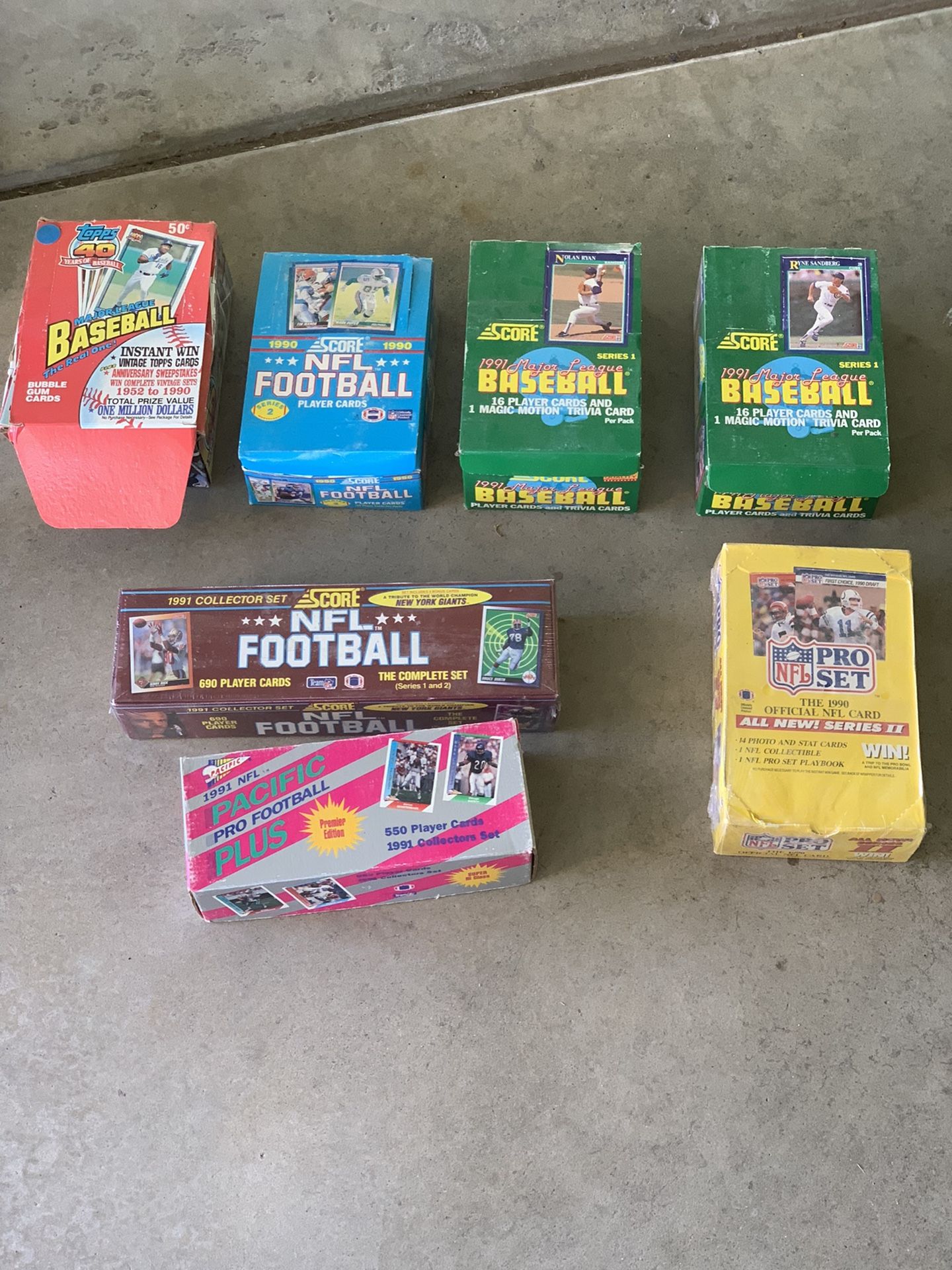 Unopened MLB and NFL cards from 90’