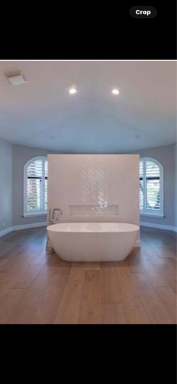 67” white modern acrylic freestanding soaking tub with chrome bathtub fixtures - excellent condition