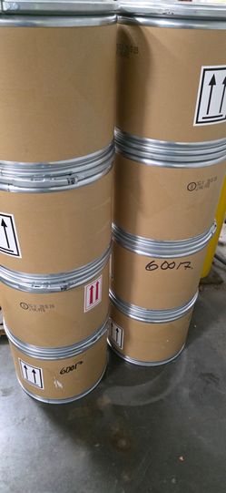 Rigid cardboard or paper fiber bodies with metal locking bands and lids.