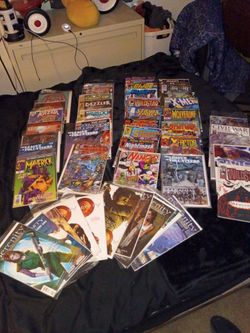 Comic books from Justice League marvel Superman hulk X-Men Batman Spider-Man serenity and a bunch of ones
