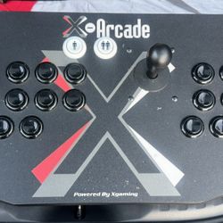  X-Arcade Tankstick, a two-player arcade-style gaming controller. 