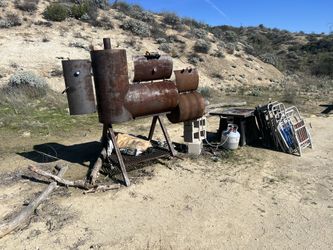 Smoker, Propane Fire Pit, lawn chairs And Propane Tank.