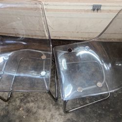 Two Cool Stylish Clear Chairs