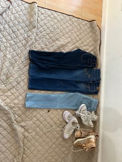 4 size 7 pants and 3 pairs of shoes size 2 and 3