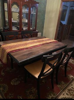 A wooden table and 4 matching chairs