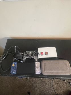Nintendo switch oled with doc, hdmi cable,charger & 2 games led light control and Pokemon joy cons