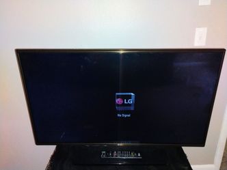 40 inch Black LG TV, Remote, & Power Cord.