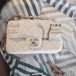 Chanel
White Quilted Lambskin Coco Clips Mini Flap Bag Aged Gold and Ruthenium Hardware, 2022