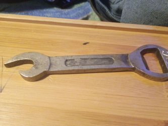 Handheld wrench bottle opener