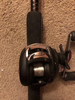 Ugly stick fishing rod with Shakespeare bait caster. 6 foot 6 inch