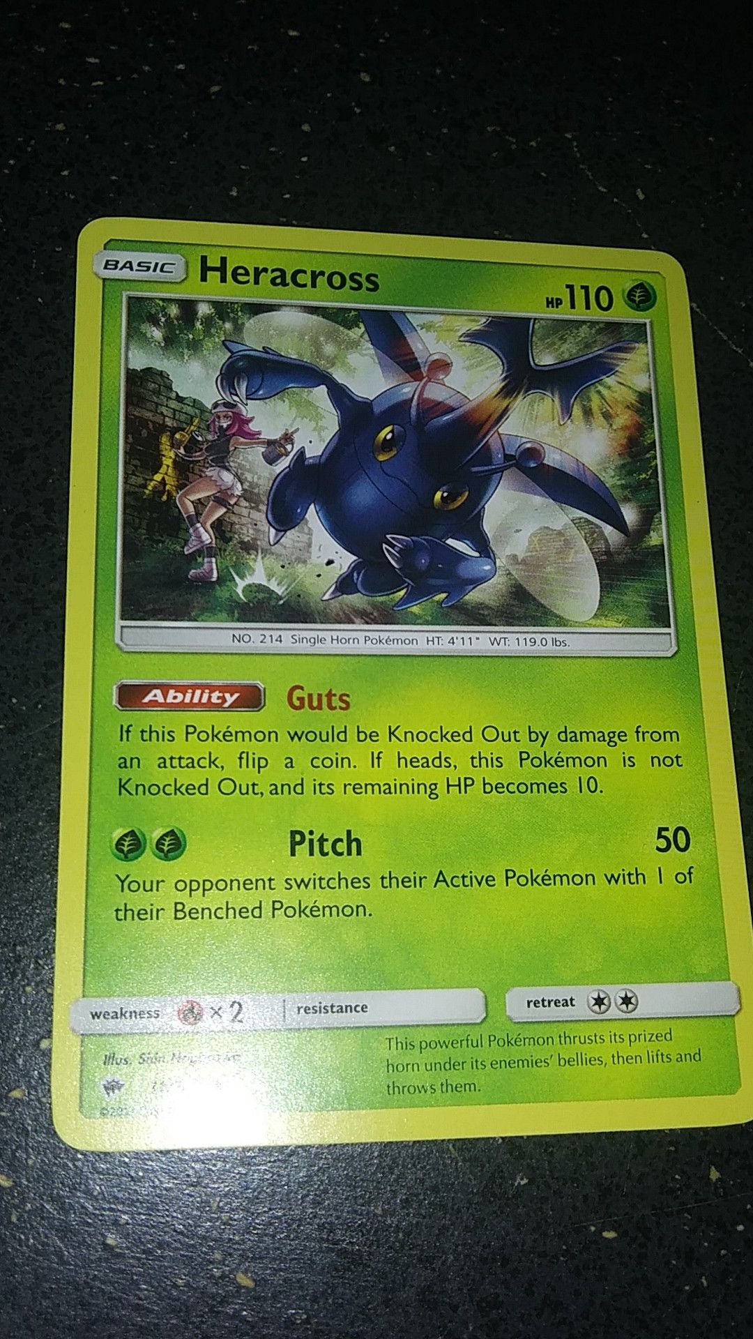 Is a Heracross Pokemon card.